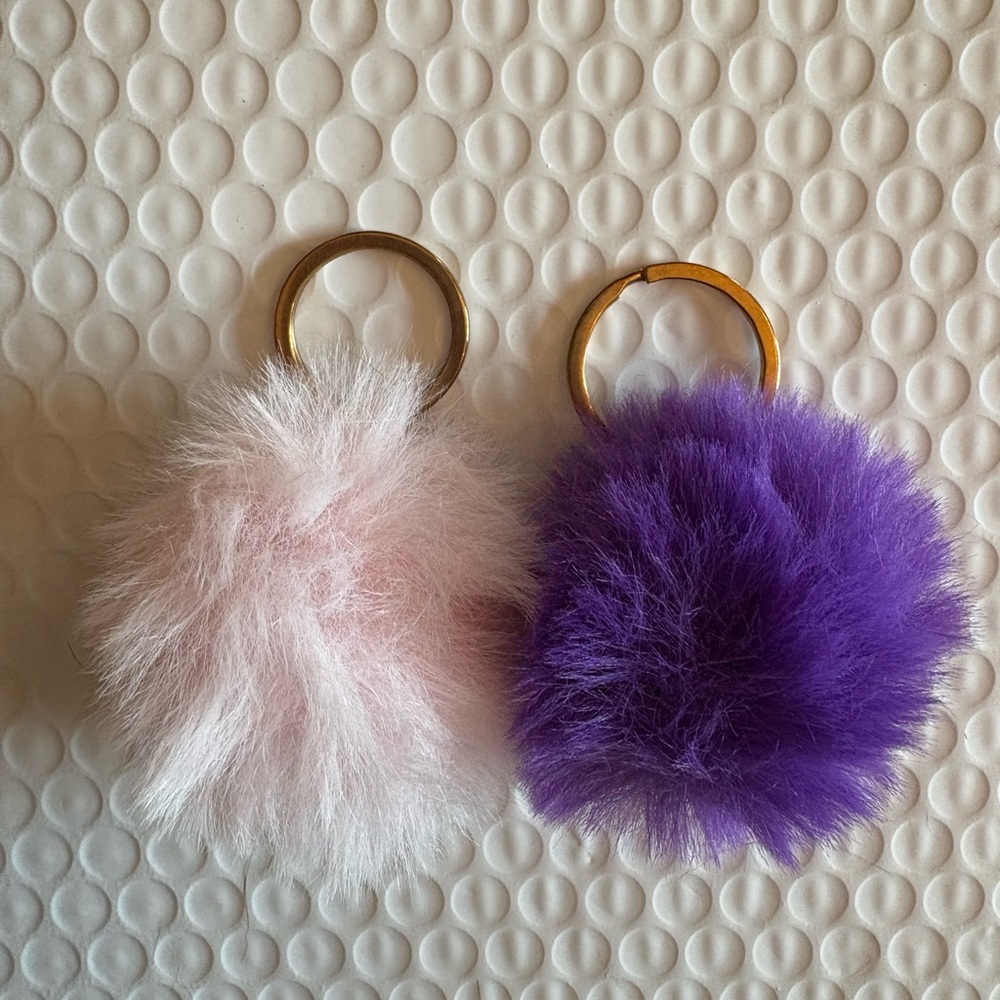 Pink and purple “puff balls” To add to bag charms.
